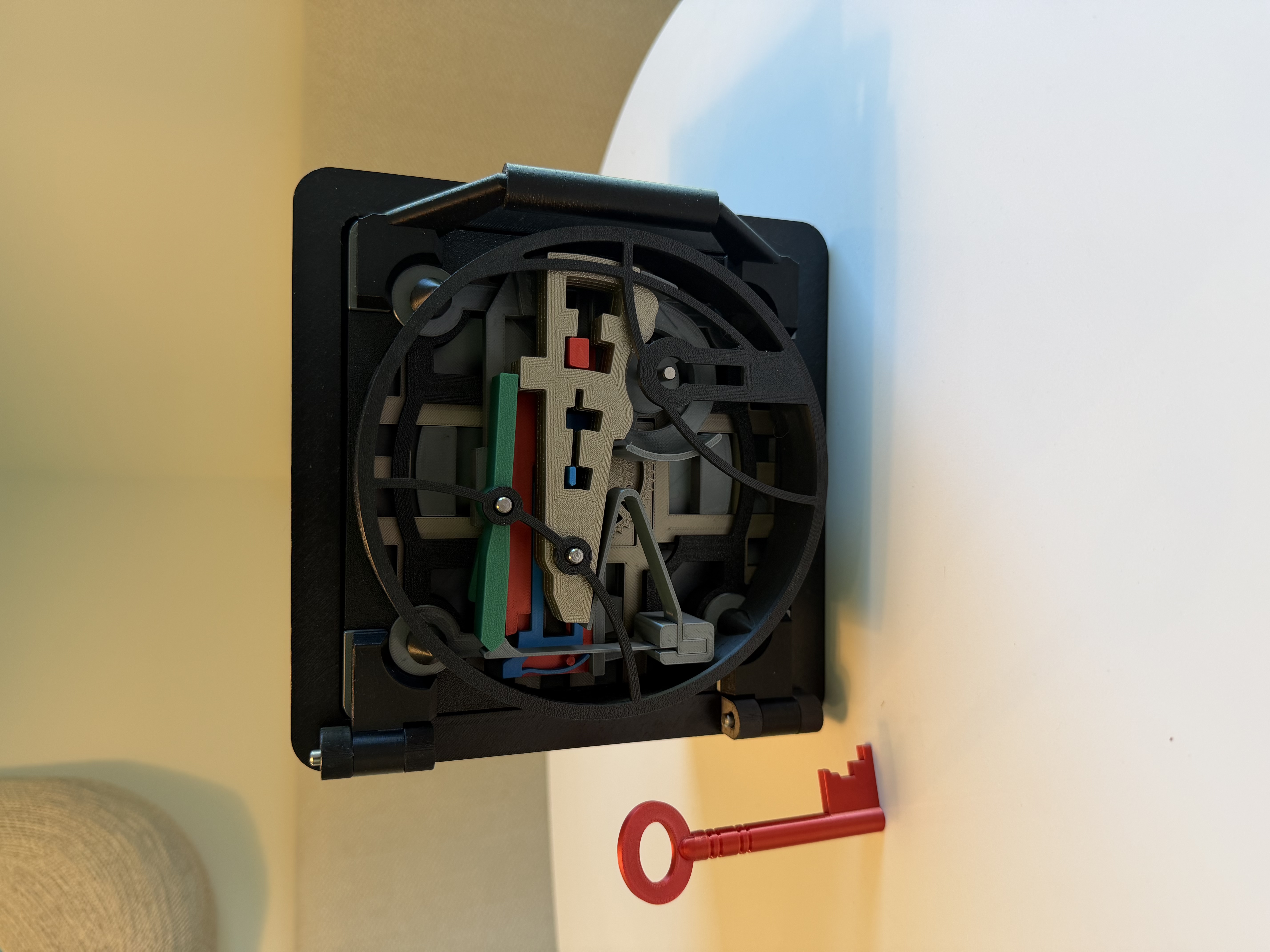 3D printed black vault with red key