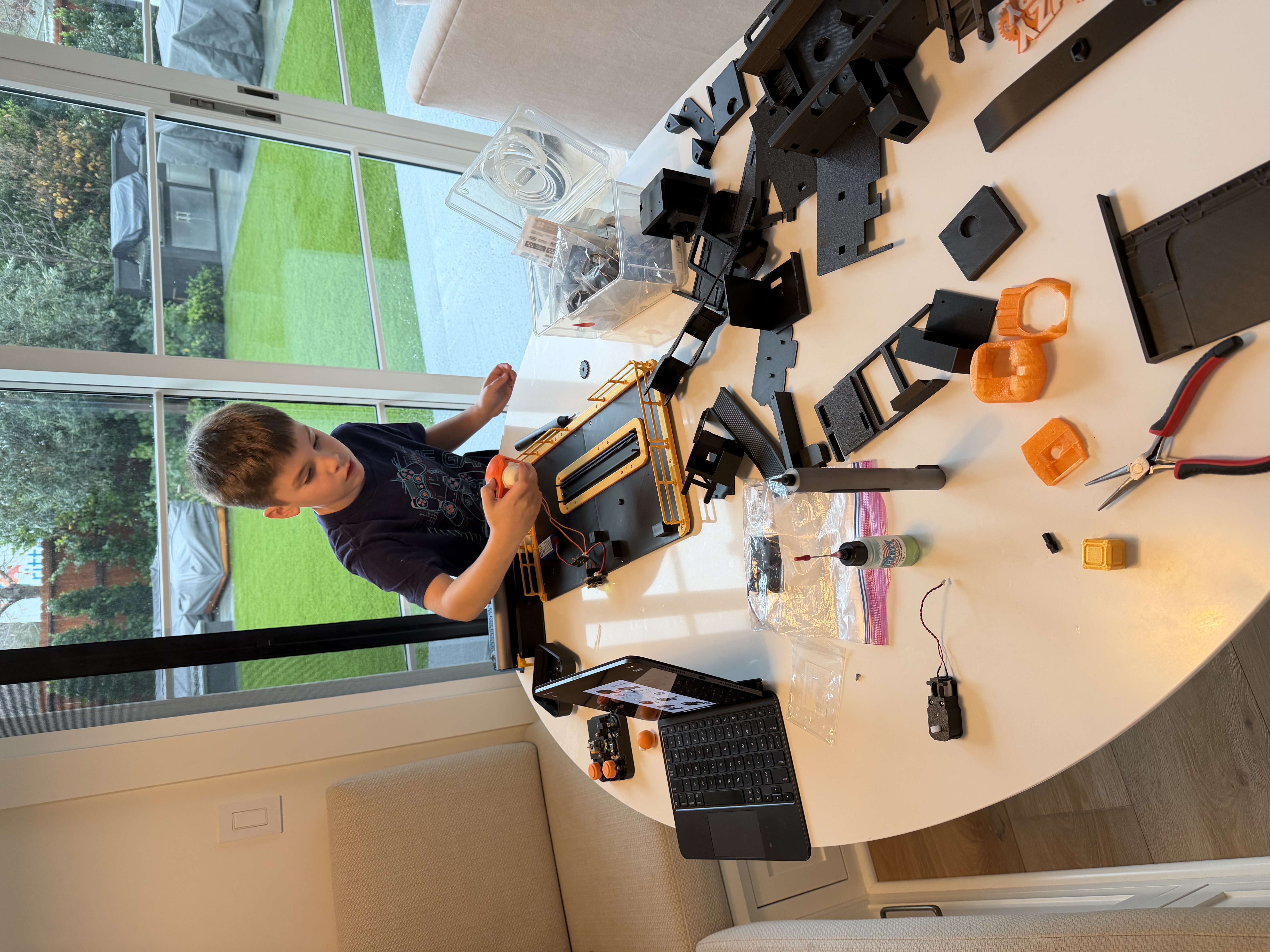 Luke assembling RC car parts