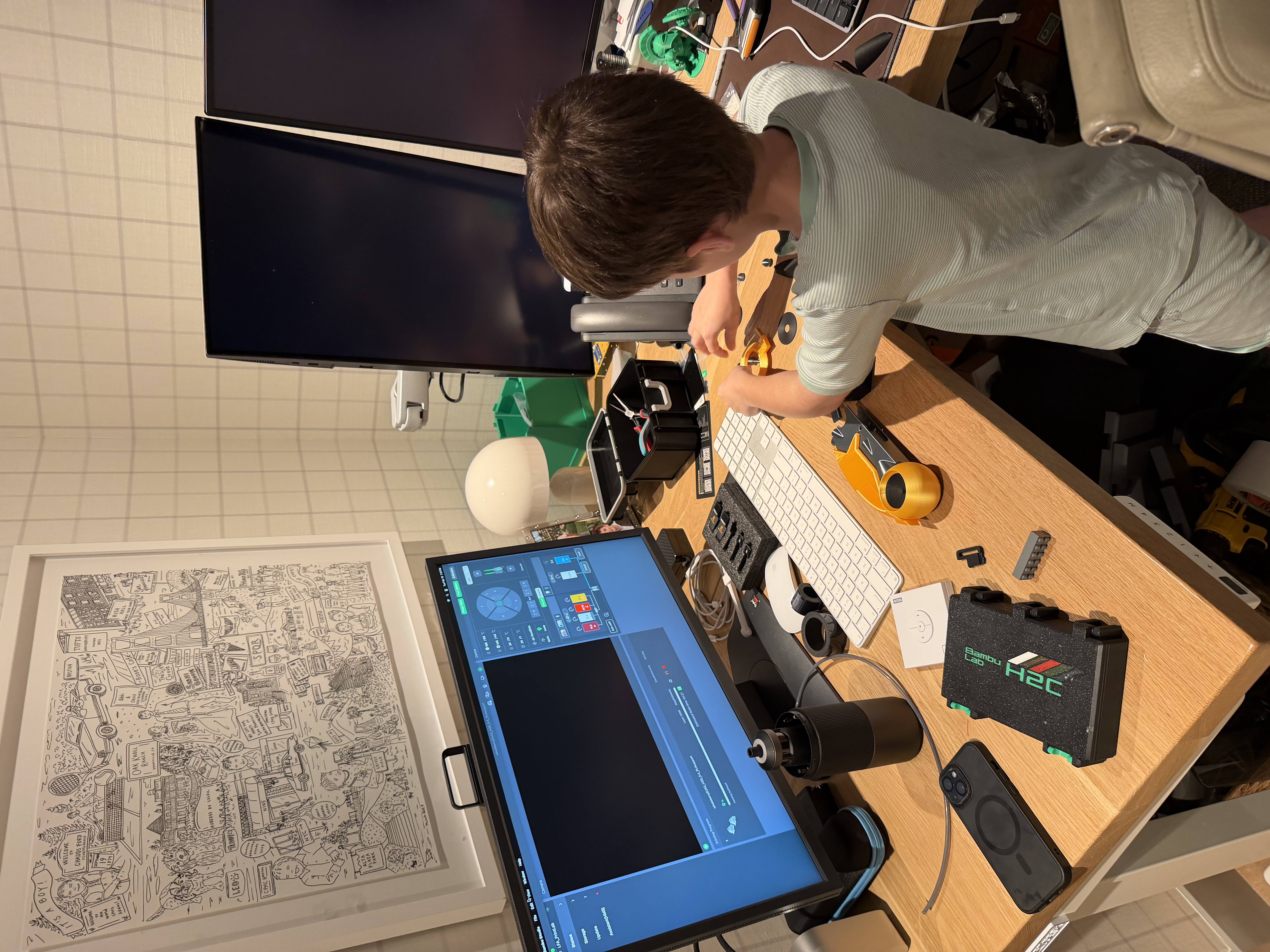 Luke at his lab desk designing on computer