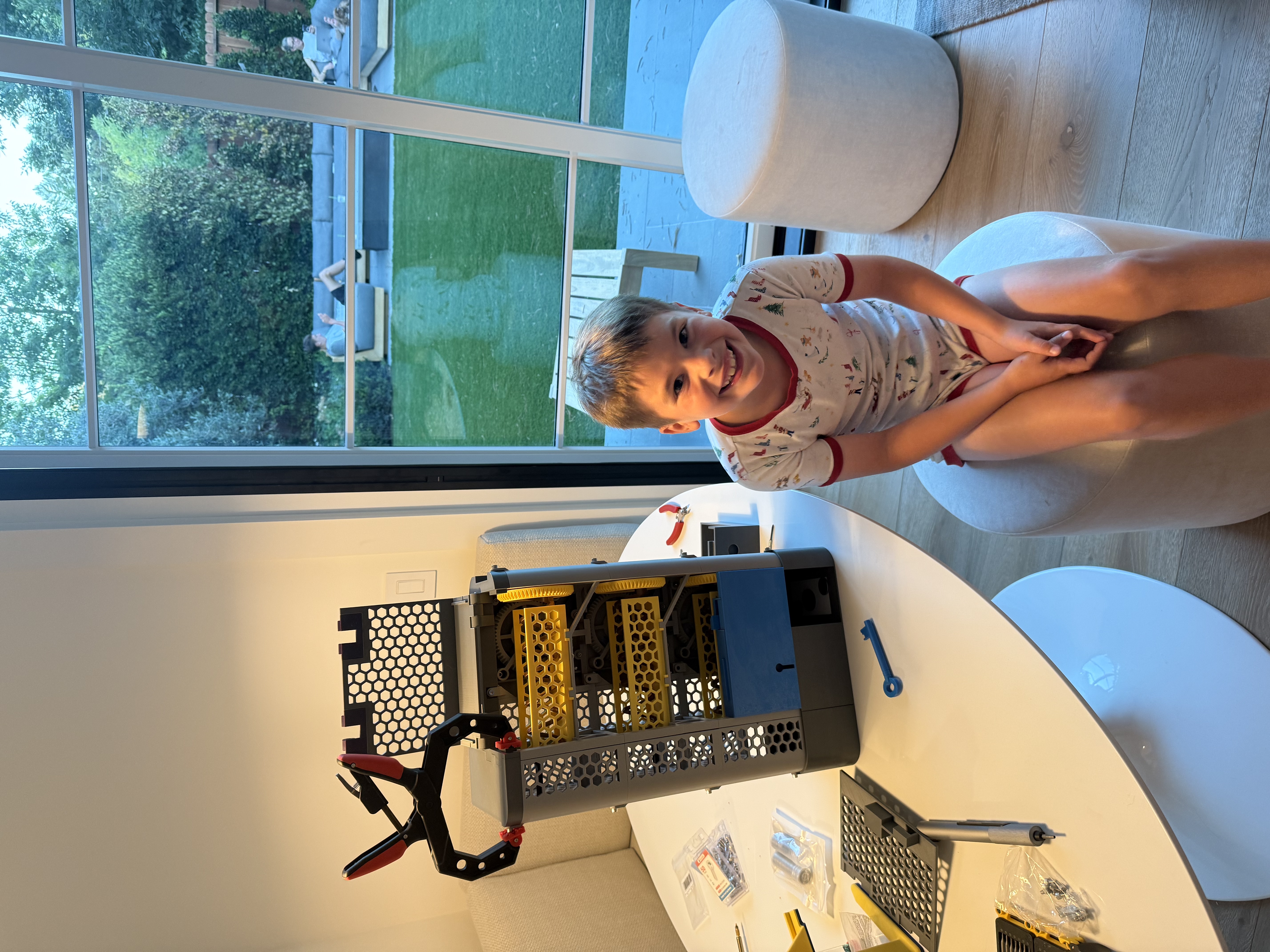 Luke with candy vending machine build in progress