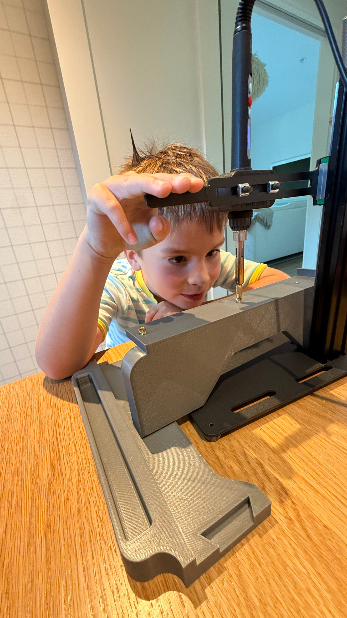 Luke carefully screwing parts together