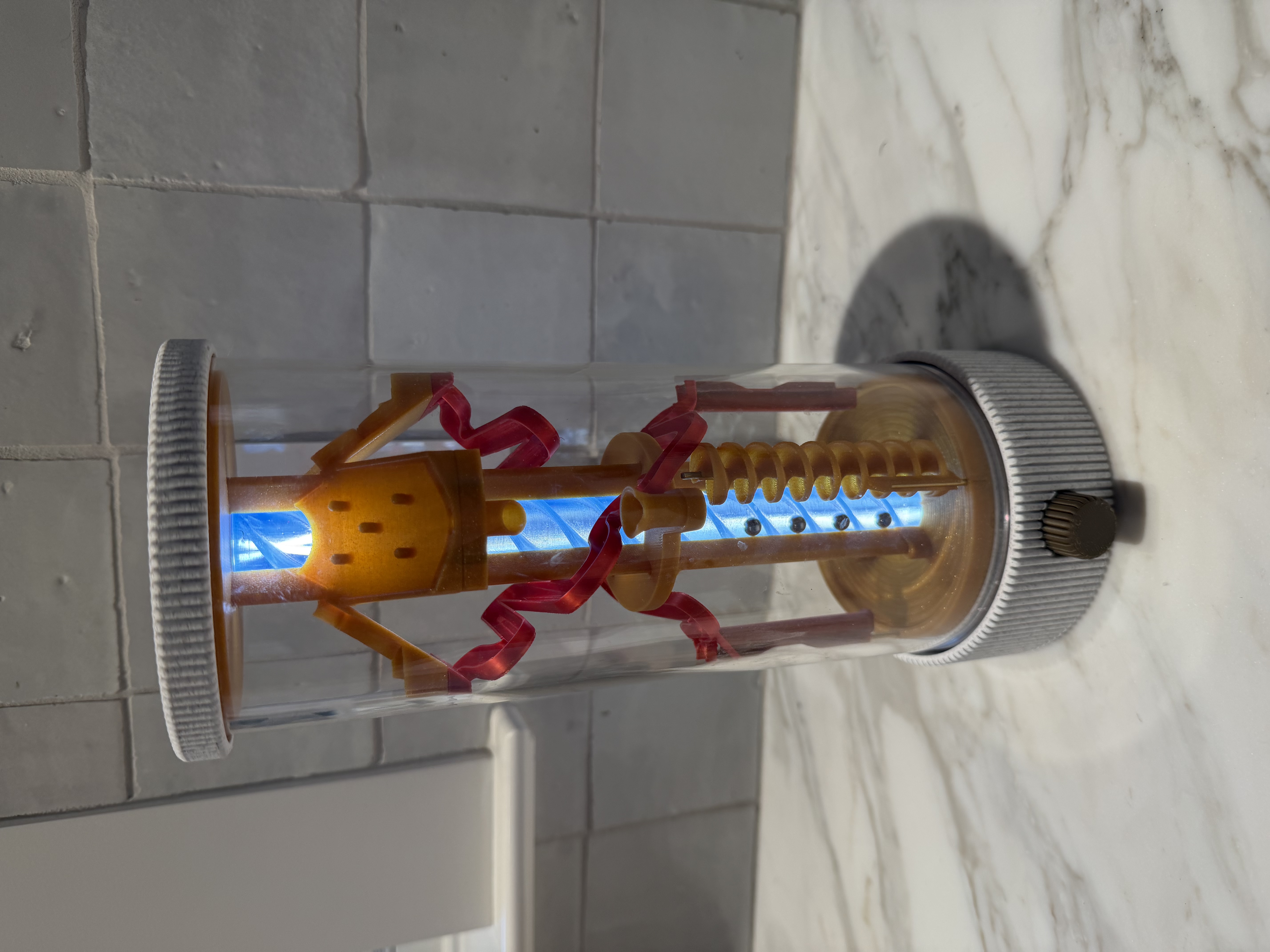 3D printed marble run lamp with glowing blue light