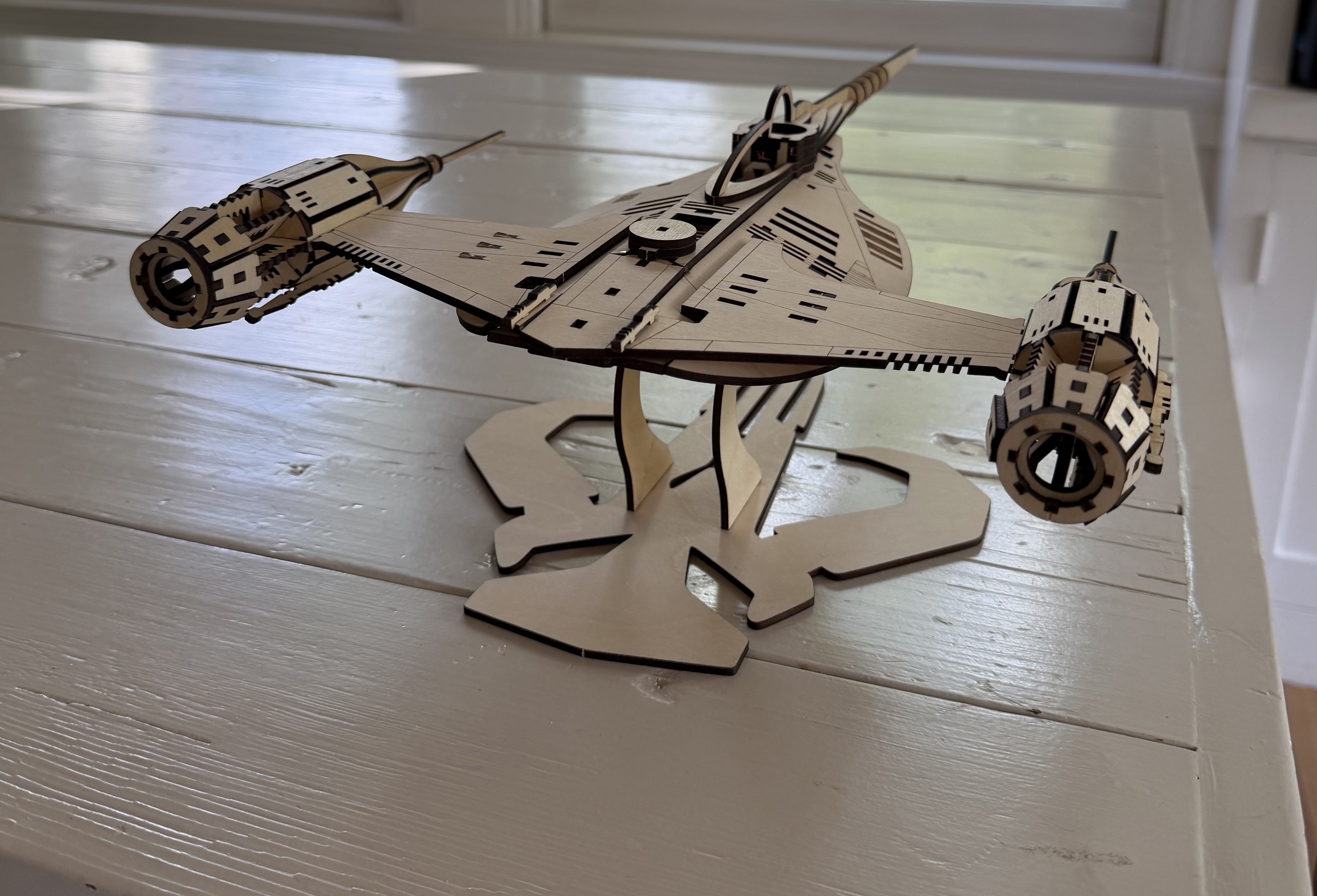Laser cut wooden Mandalorian Razor Crest ship on stand