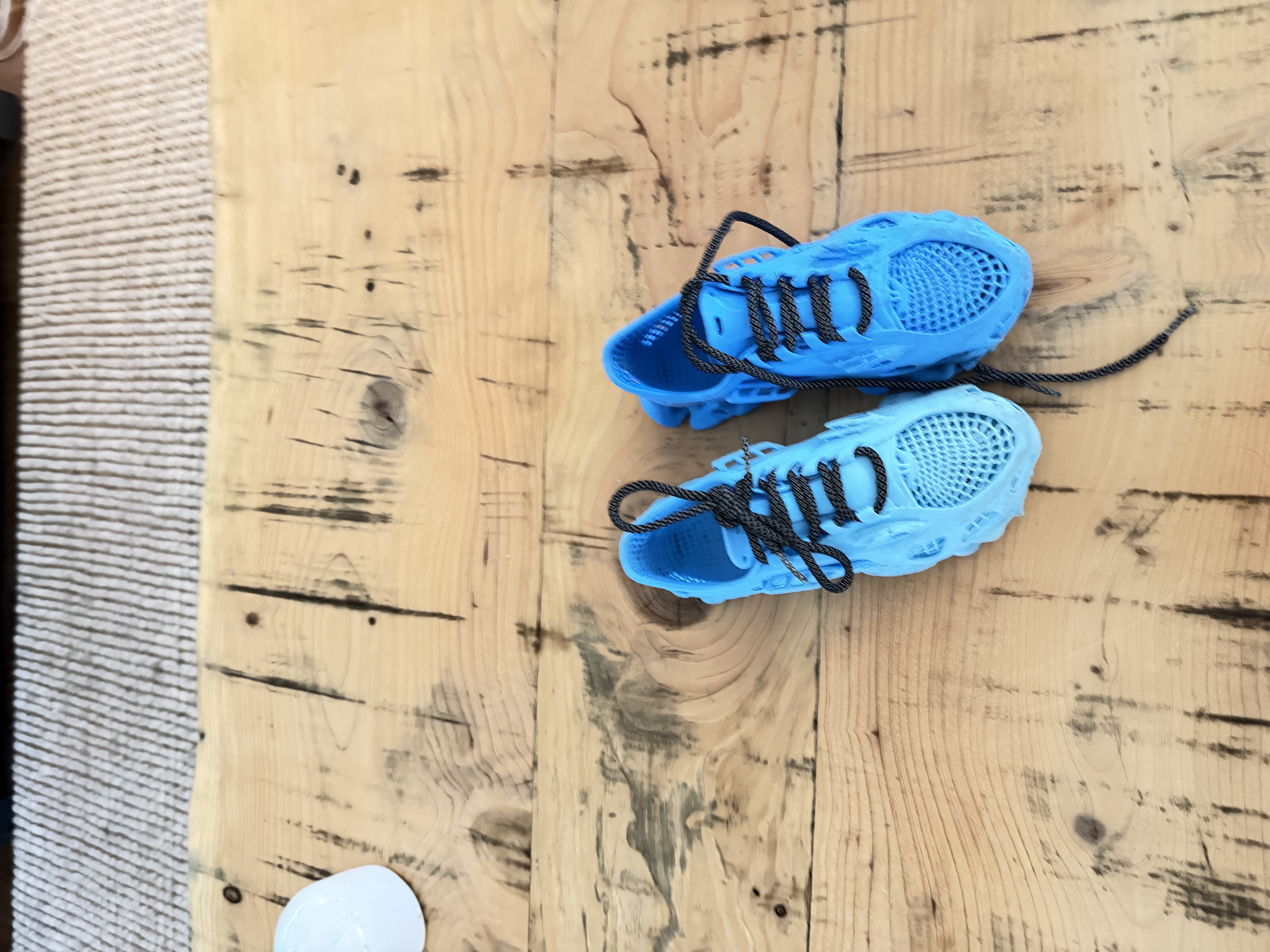 3D printed blue shoes with laser engraved whaleberry insoles
