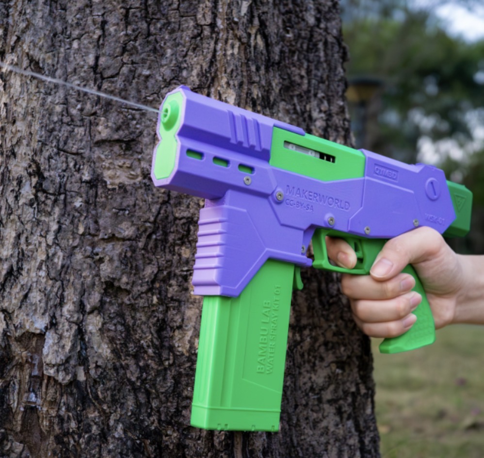 3D printed purple and green water gun shooting